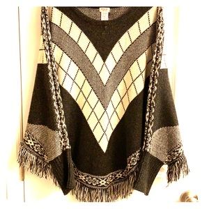 Sweater poncho with fringe
